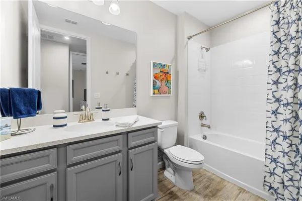 a bathroom with a toilet a sink and a bathtub