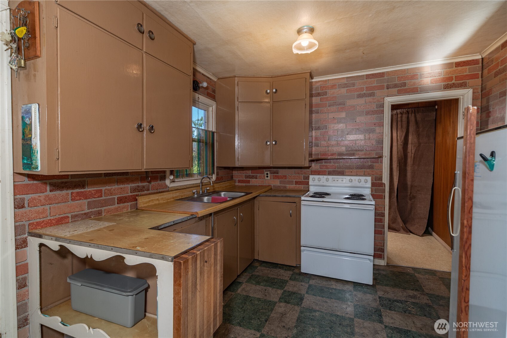 781 Irondale Road Port Hadlock, WA 98339 - Photo 13 of 25 a kitchen that has a sink and a stove