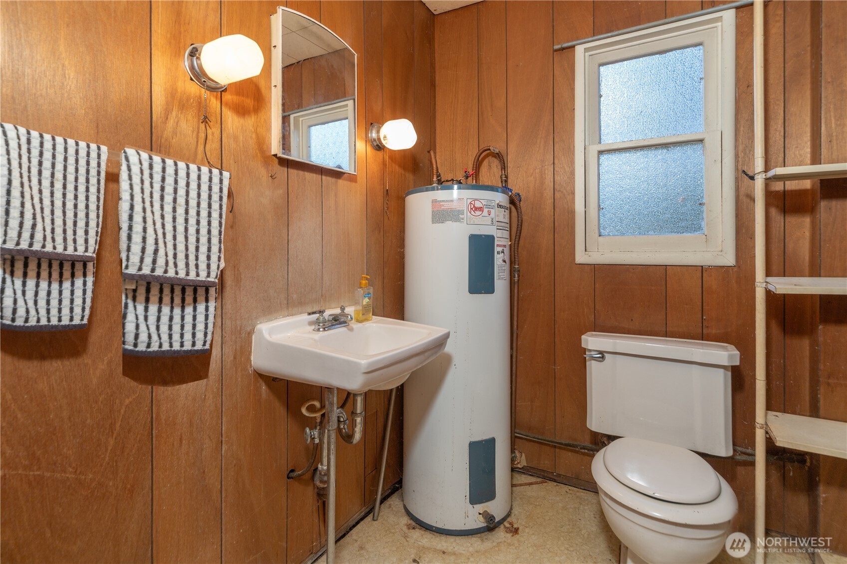 781 Irondale Road Port Hadlock, WA 98339 - Photo 16 of 25 a bathroom with a toilet a sink and mirror