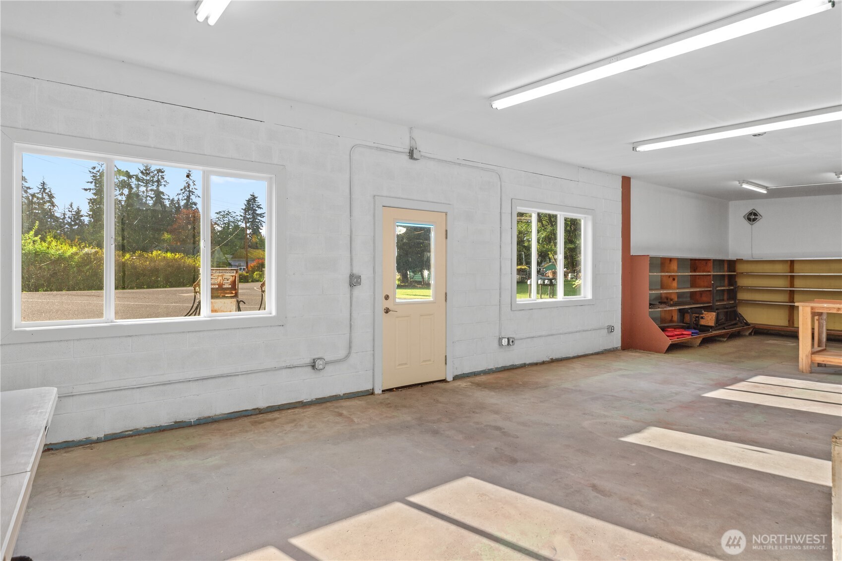 781 Irondale Road Port Hadlock, WA 98339 - Photo 9 of 25 a view of an empty room with a fireplace and a window