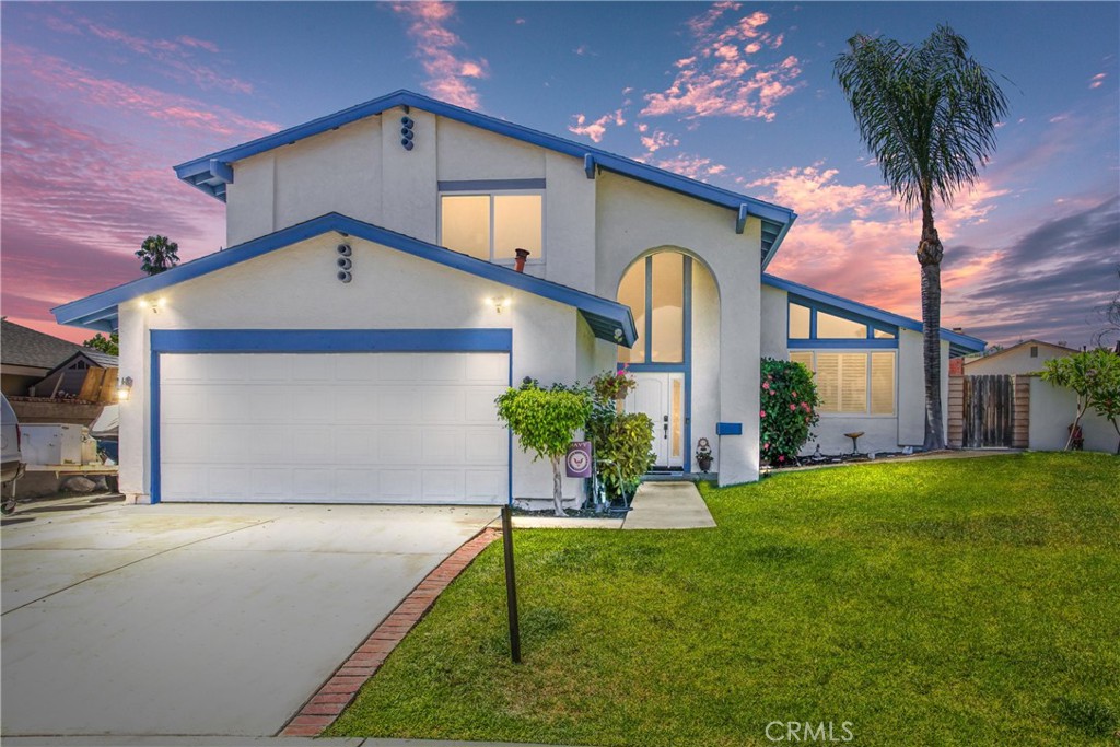 7030 Teak Way Rancho Cucamonga, CA 91701 - Photo 1 of 1 a front view of a house with a yard and garage