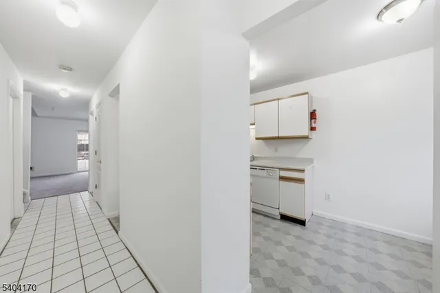 a view of a kitchen with a sink and a stove top oven