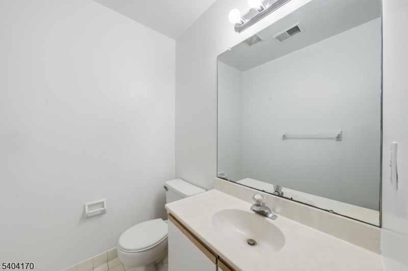 403 Union Street Boonton, NJ 07005 - Photo 9 of 24 a bathroom with a sink toilet and vanity