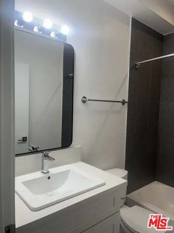 a bathroom with a sink and mirror