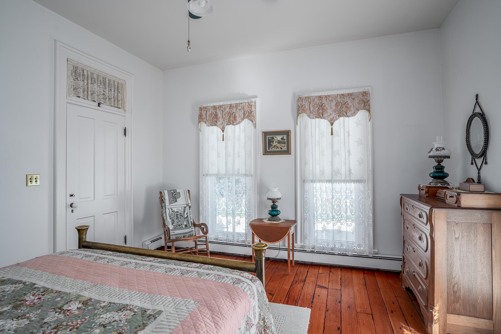 704 River Street Sabula, IA 52070 - Photo 11 of 33 a bedroom with furniture and a window