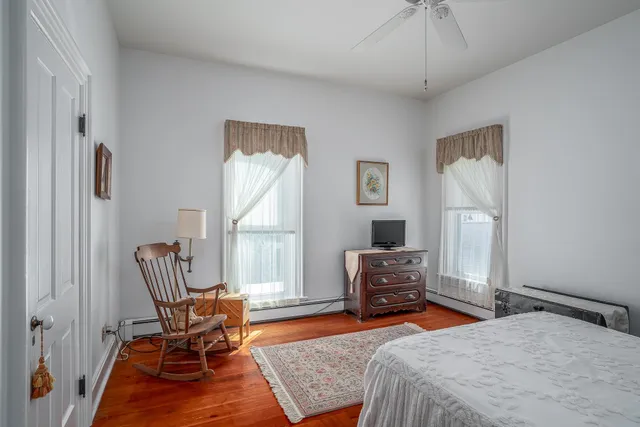 a bed room with a bed and a lamp