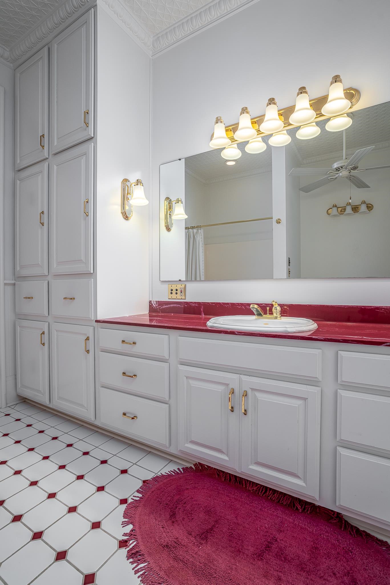 704 River Street Sabula, IA 52070 - Photo 17 of 33 a bathroom with a sink vanity and mirror