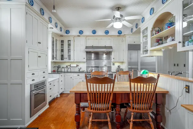 a bedroom with furniture and a chandelier