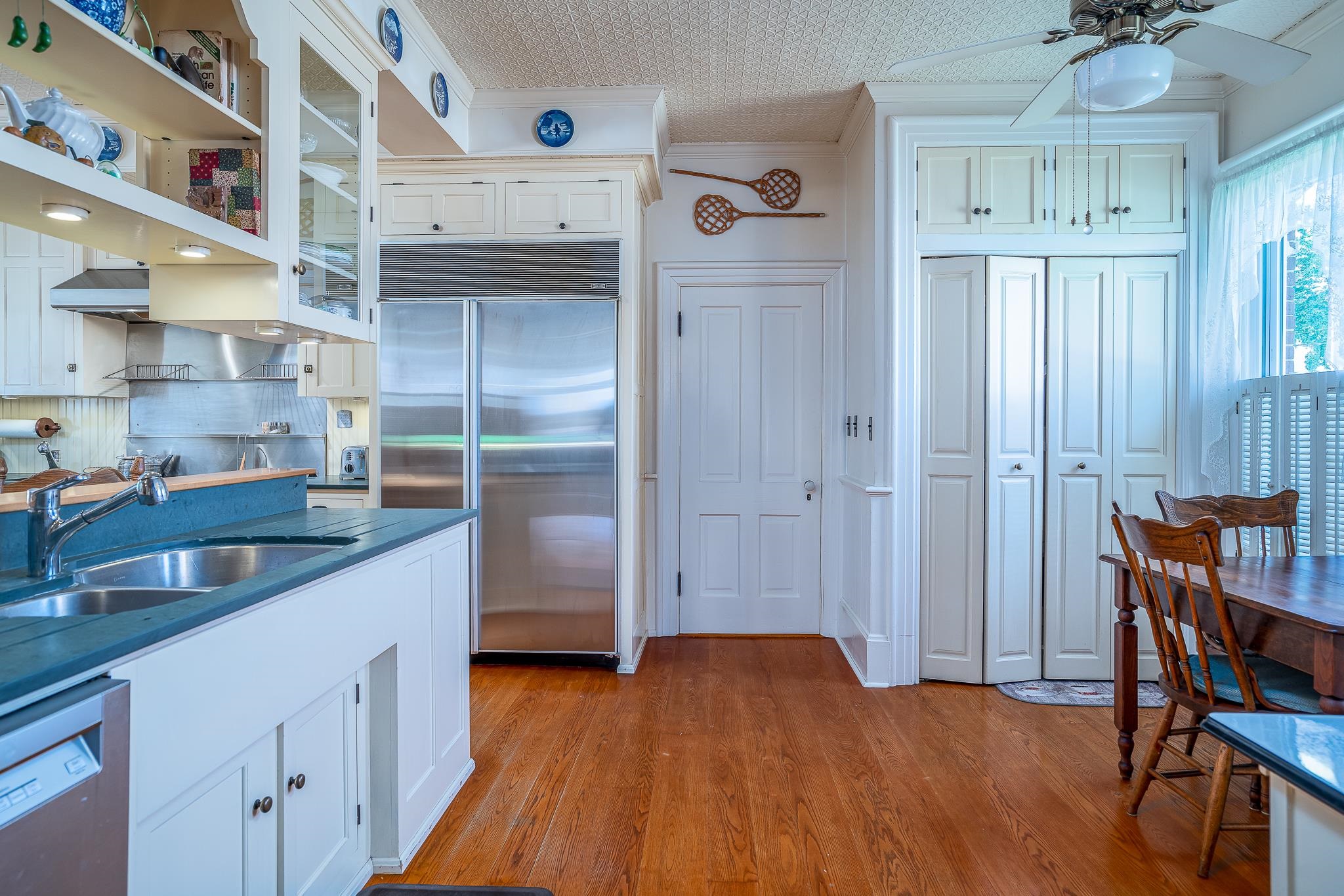 704 River Street Sabula, IA 52070 - Photo 32 of 33 a kitchen with stainless steel appliances granite countertop a refrigerator and a sink