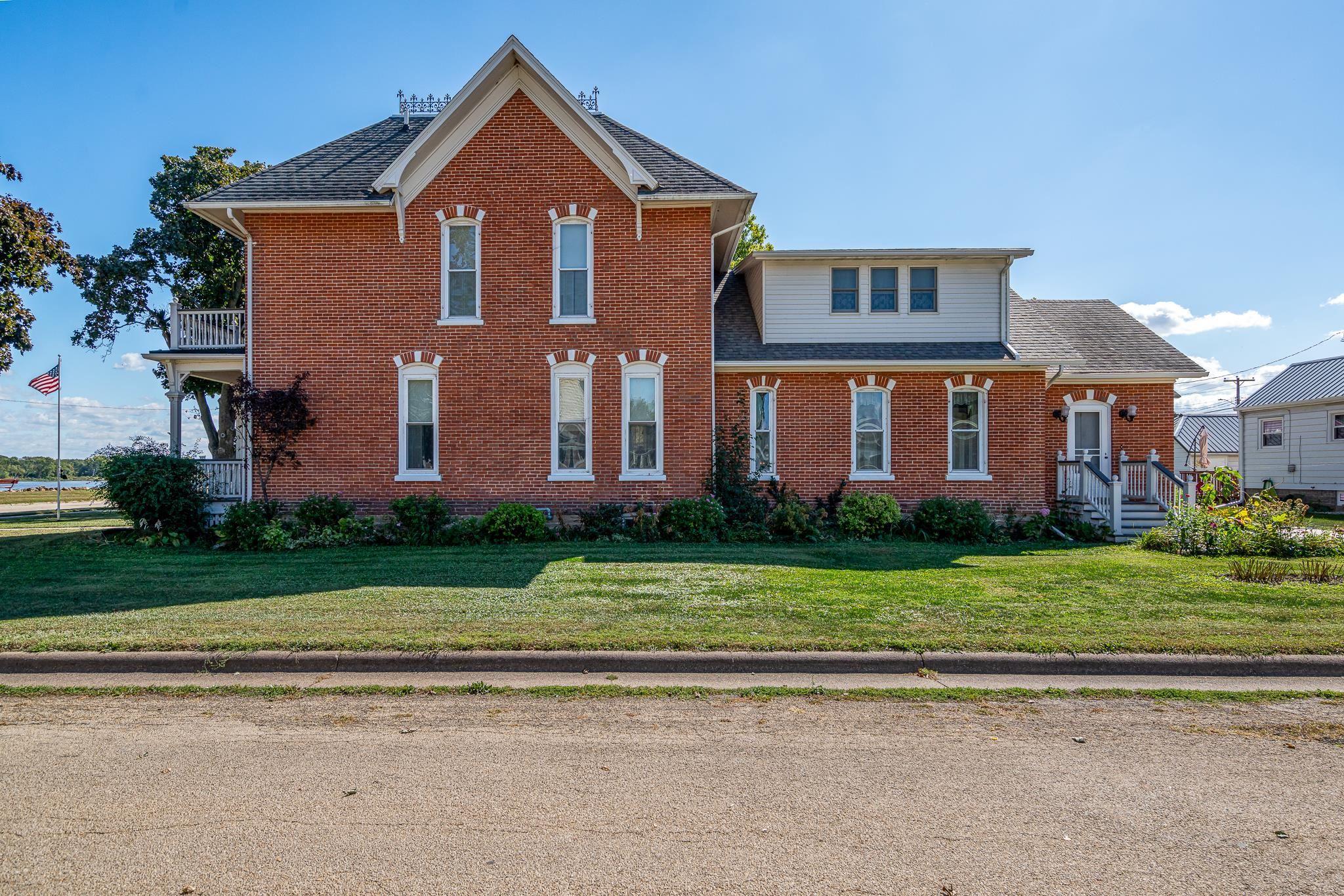 704 River Street Sabula, IA 52070 - Photo 9 of 33 a front view of a house with a yard