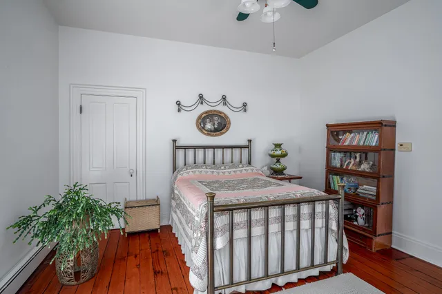 a bedroom with furniture and a window