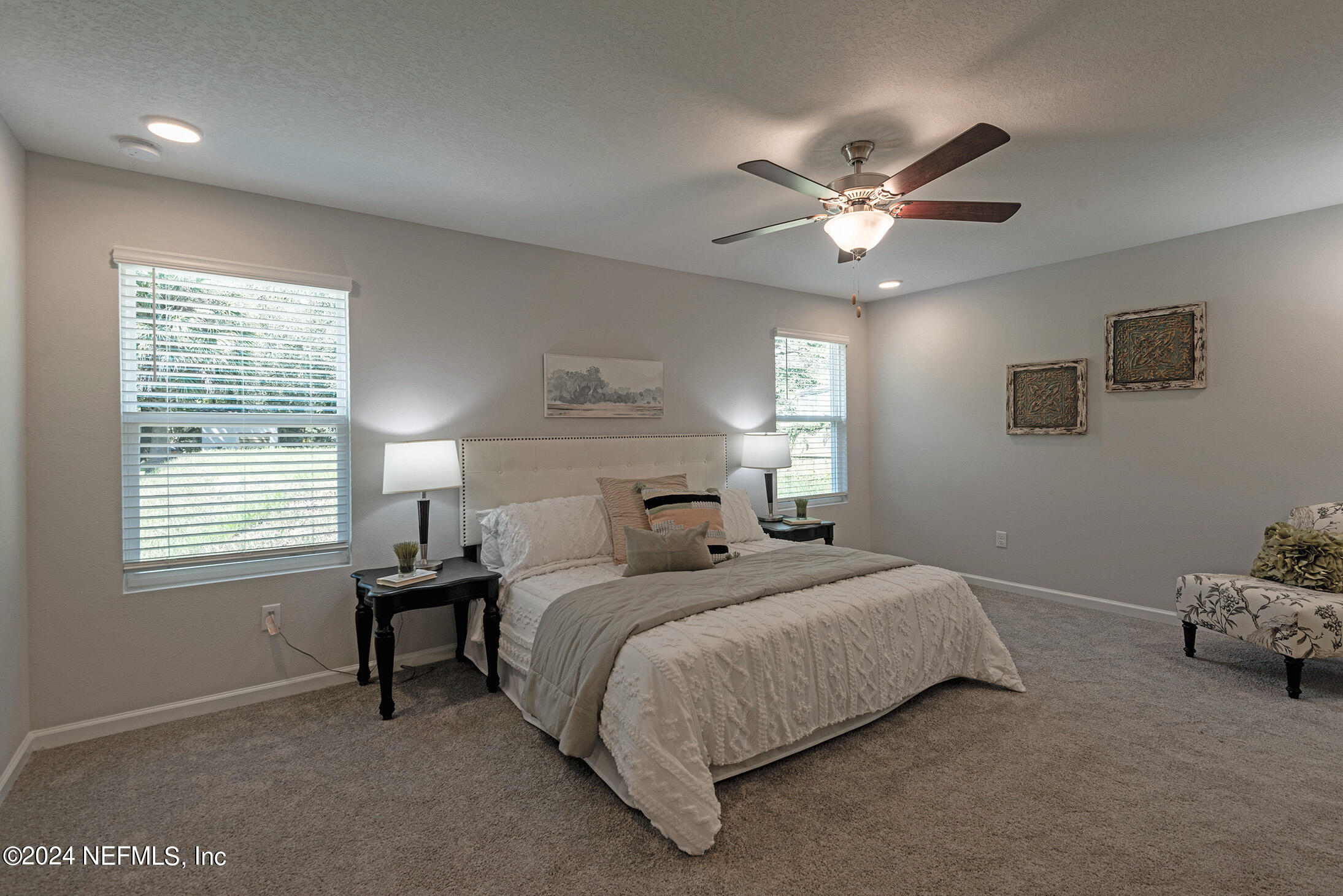 11814 Dunn Creek Road Jacksonville, FL 32218 - Photo 17 of 50 a bedroom with a bed and a window