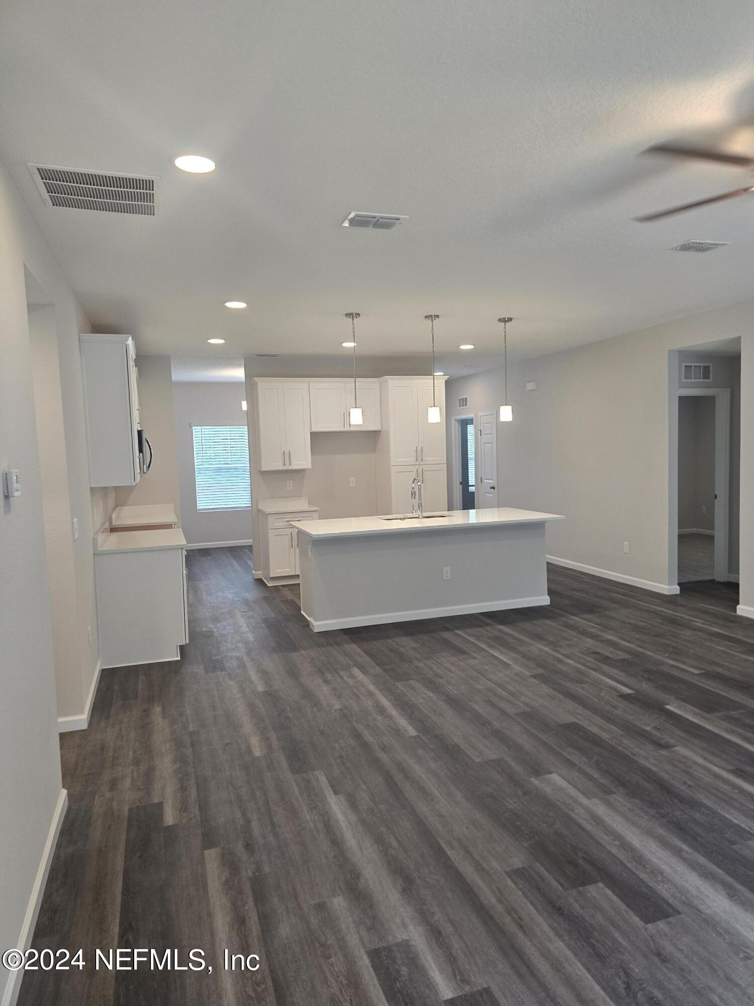 11814 Dunn Creek Road Jacksonville, FL 32218 - Photo 19 of 50 a view of kitchen and hall with wooden floor