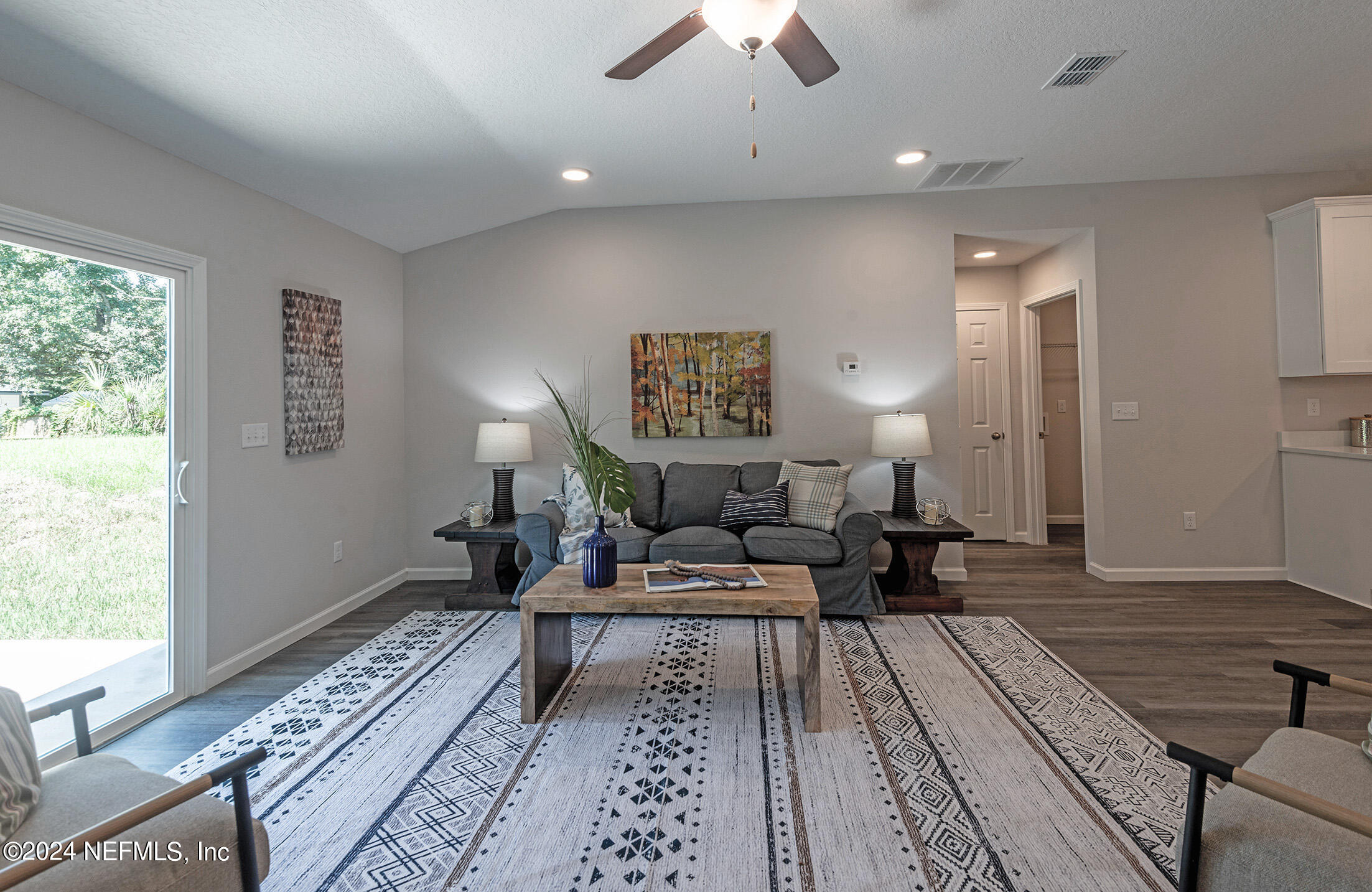 11814 Dunn Creek Road Jacksonville, FL 32218 - Photo 32 of 50 a living room with furniture and a rug