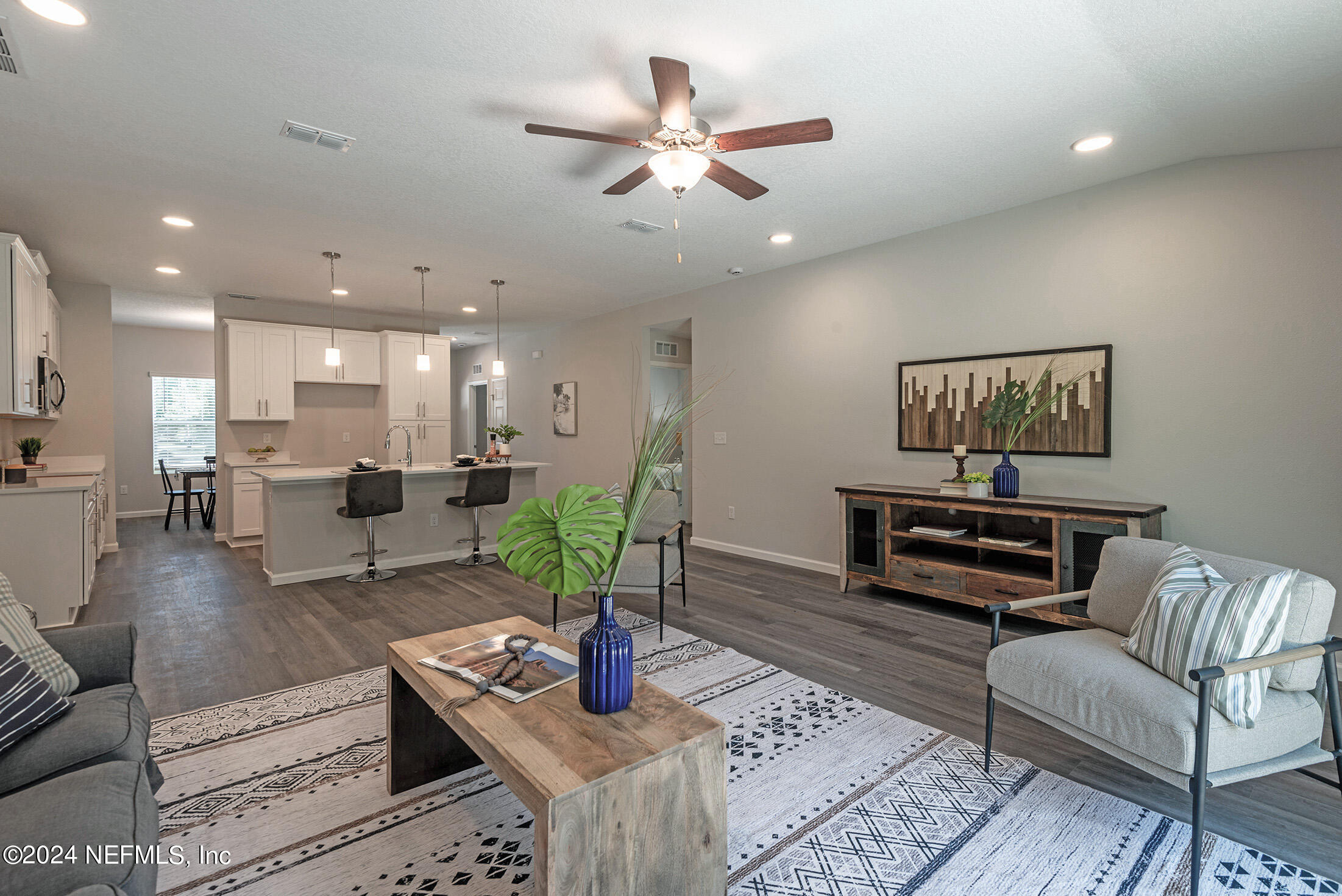 11814 Dunn Creek Road Jacksonville, FL 32218 - Photo 34 of 50 a living room with furniture kitchen view and a table