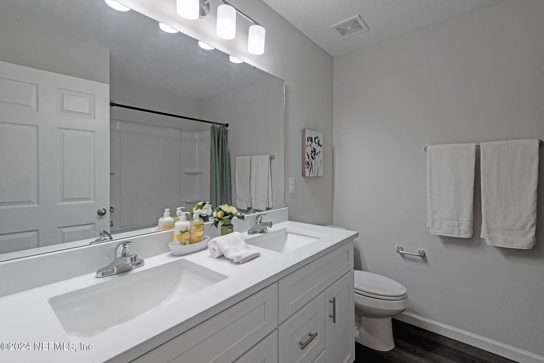 11814 Dunn Creek Road Jacksonville, FL 32218 - Photo 40 of 50 a bathroom with a sink vanity granite and toilet