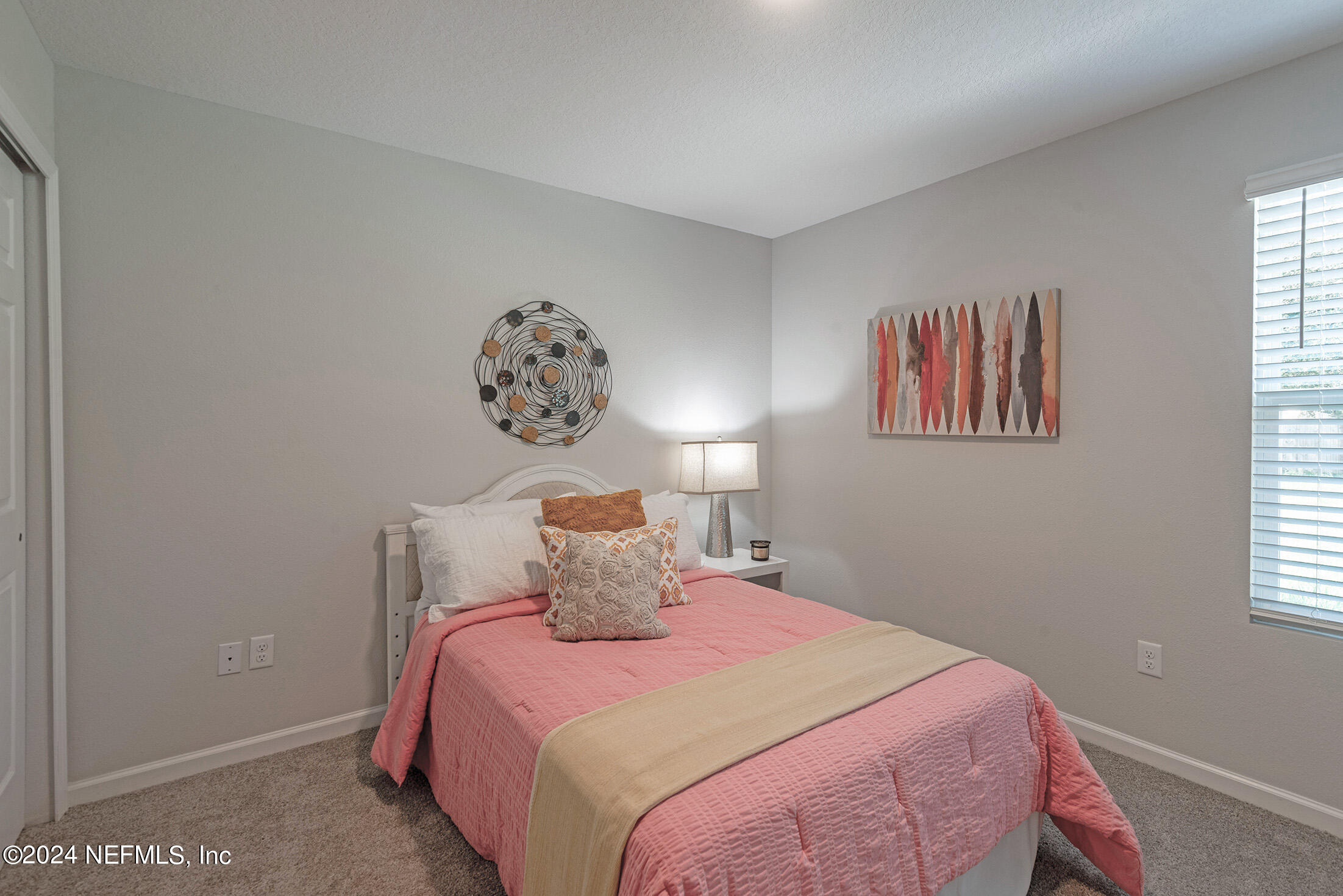 11814 Dunn Creek Road Jacksonville, FL 32218 - Photo 41 of 50 a bedroom with a bed and a painting on the wall