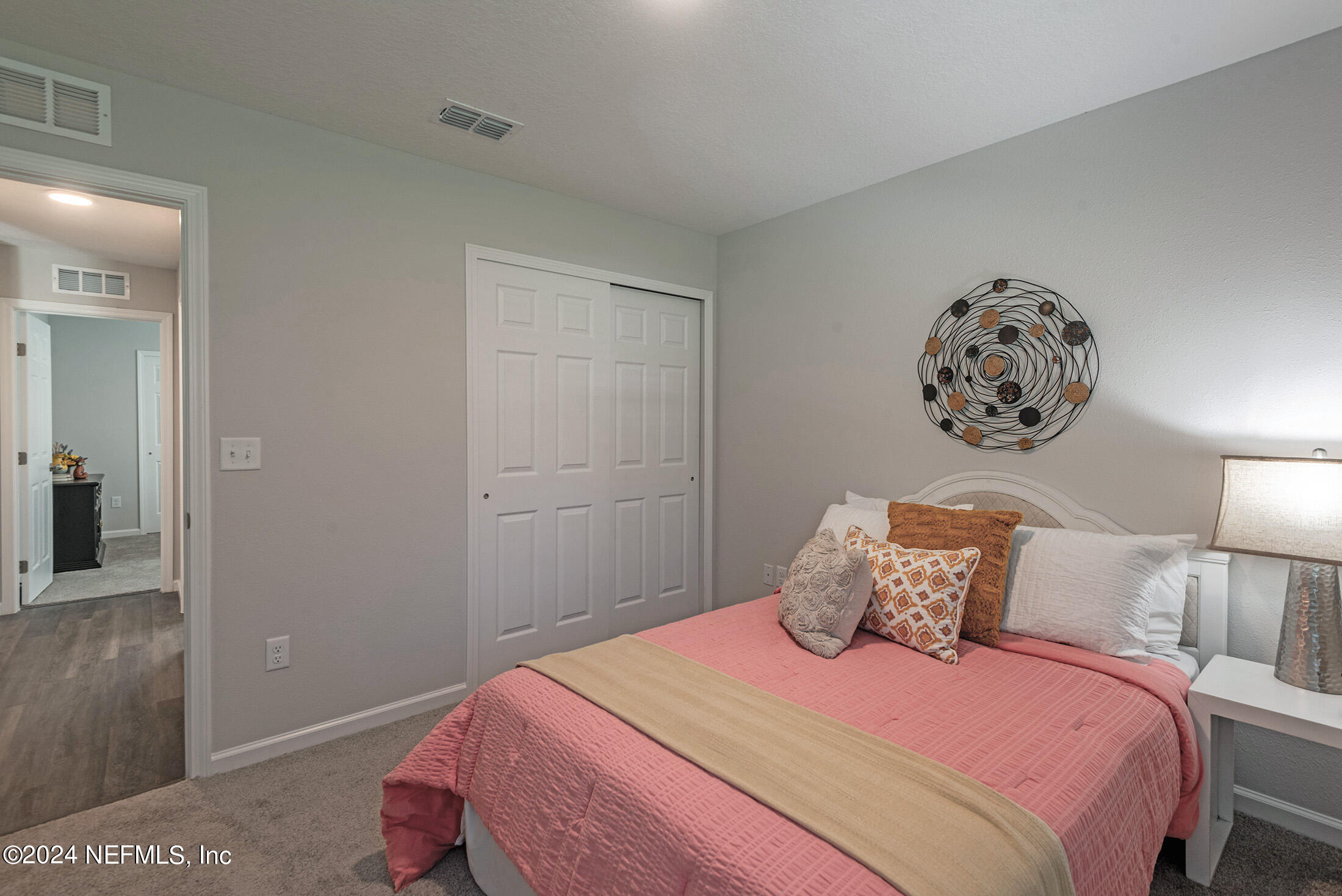 11814 Dunn Creek Road Jacksonville, FL 32218 - Photo 43 of 50 a bedroom with a bed and a painting