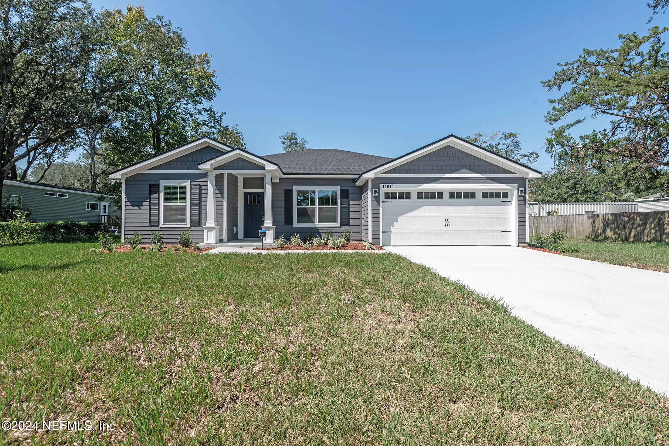 11814 Dunn Creek Road Jacksonville, FL 32218 - Photo 47 of 50 a front view of a house with a yard