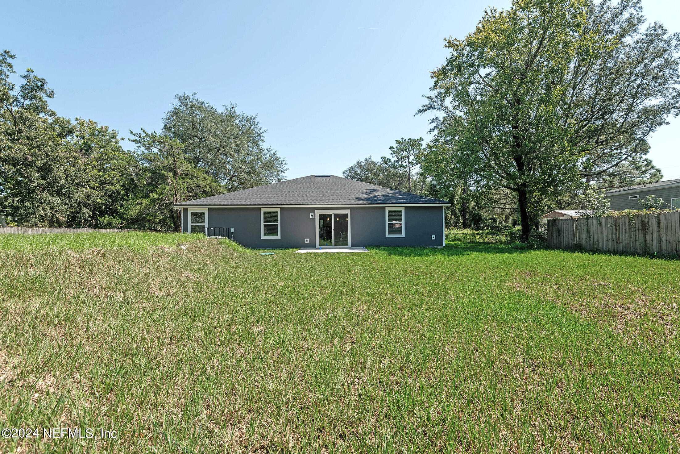11814 Dunn Creek Road Jacksonville, FL 32218 - Photo 50 of 50 a front view of house with a garden