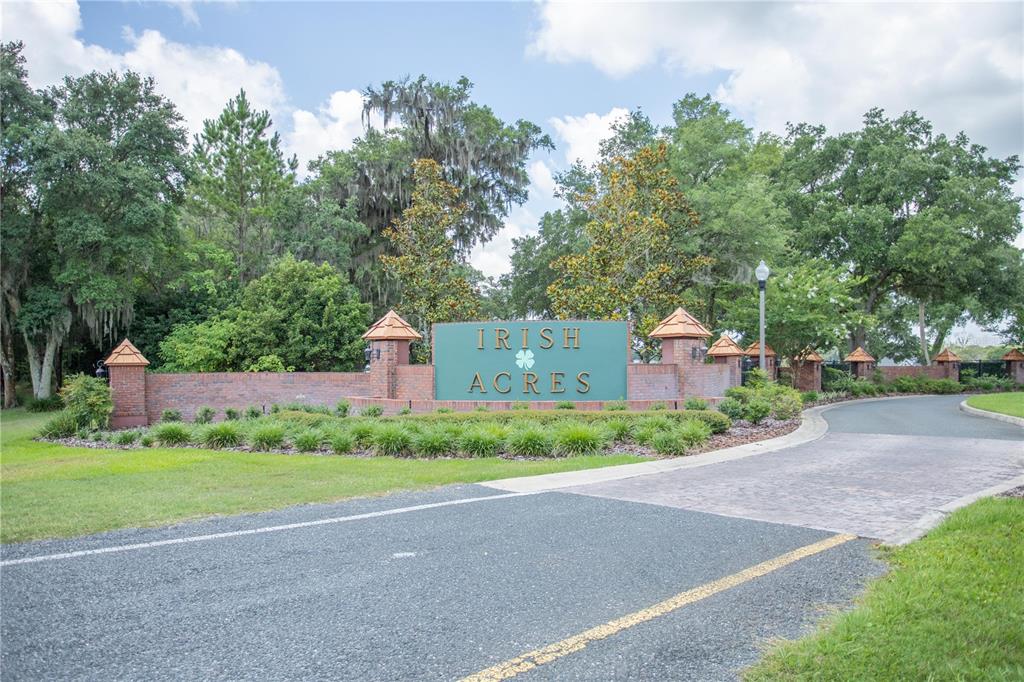 0 Northwest 17th Street Ocala, FL 34475 - Photo 11 of 13 a front view of a house with a yard and a garage