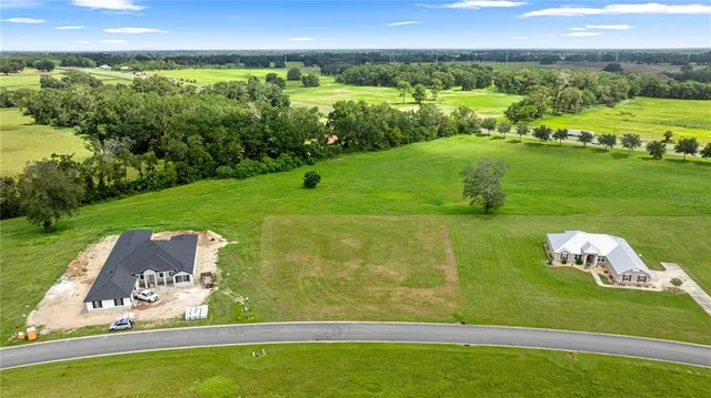 a view of a lake with a big yard