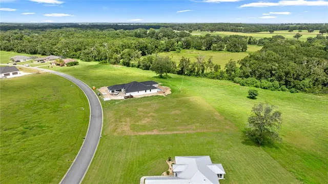 an aerial view of a golf course with a garden