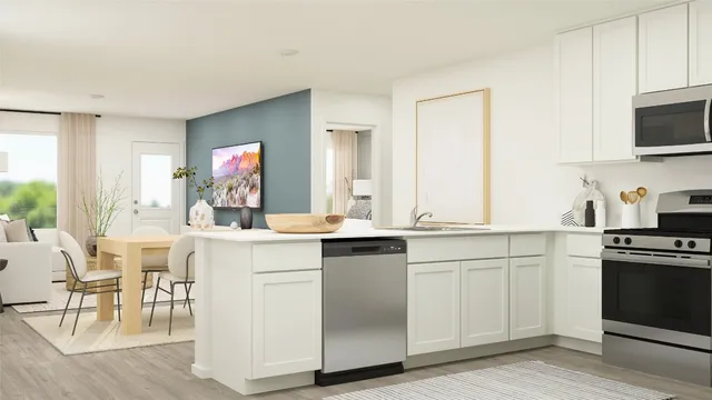 a kitchen with white cabinets and a sink