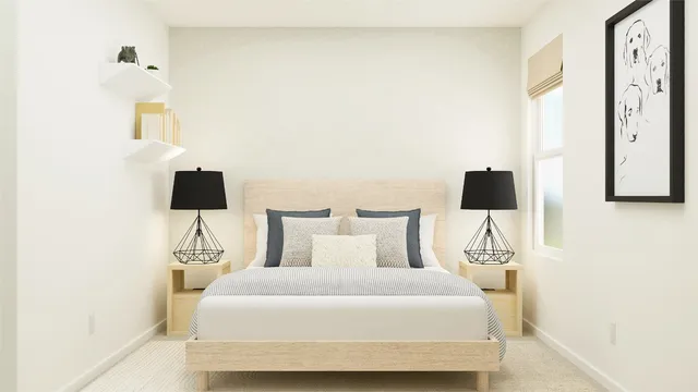 a bedroom with a bed and a night stand