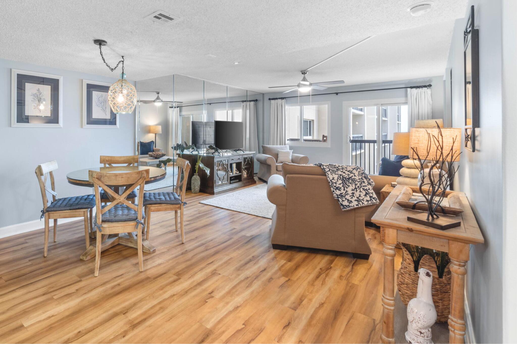 23223 Front Beach Road, Unit 308 Panama City Beach, FL 32413 - Photo 2 of 18 a living room with furniture and wooden floor