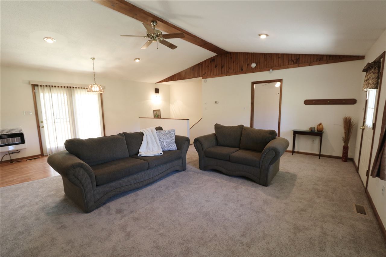2003 Shutterlee Mill Road Staunton, VA 24401 - Photo 14 of 45 a living room with furniture and a chandelier