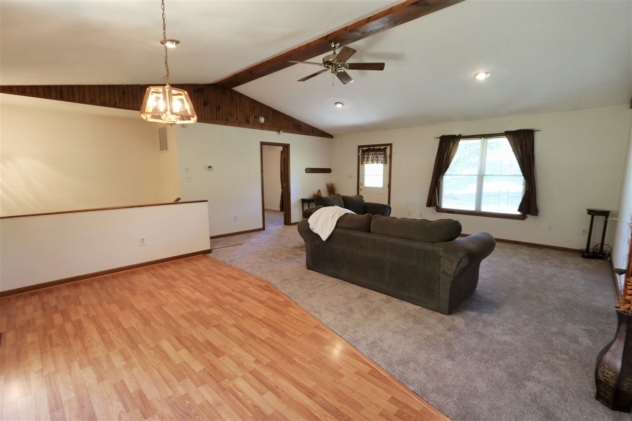 2003 Shutterlee Mill Road Staunton, VA 24401 - Photo 15 of 45 a living room with furniture and a chandelier