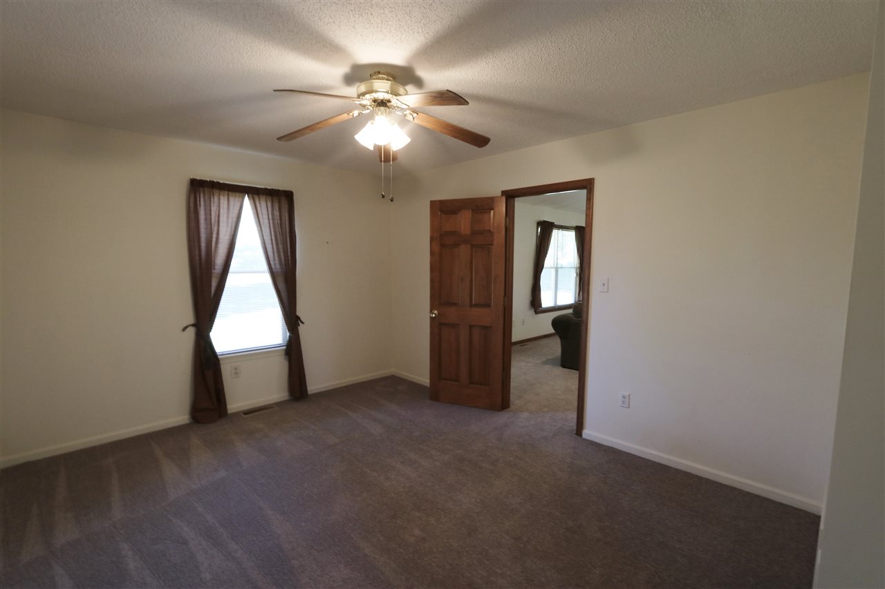 2003 Shutterlee Mill Road Staunton, VA 24401 - Photo 21 of 45 an empty room with windows and fan