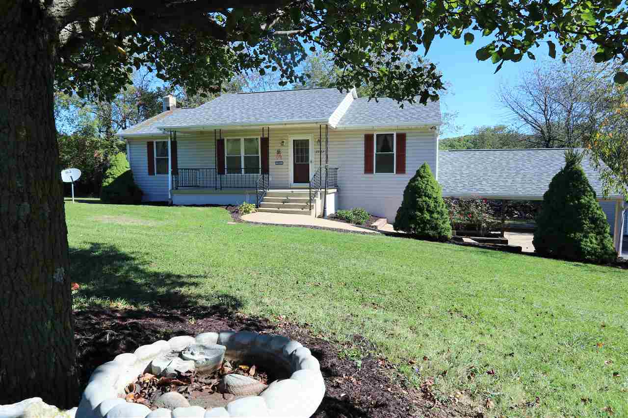 2003 Shutterlee Mill Road Staunton, VA 24401 - Photo 3 of 45 a front view of a house with a yard and porch