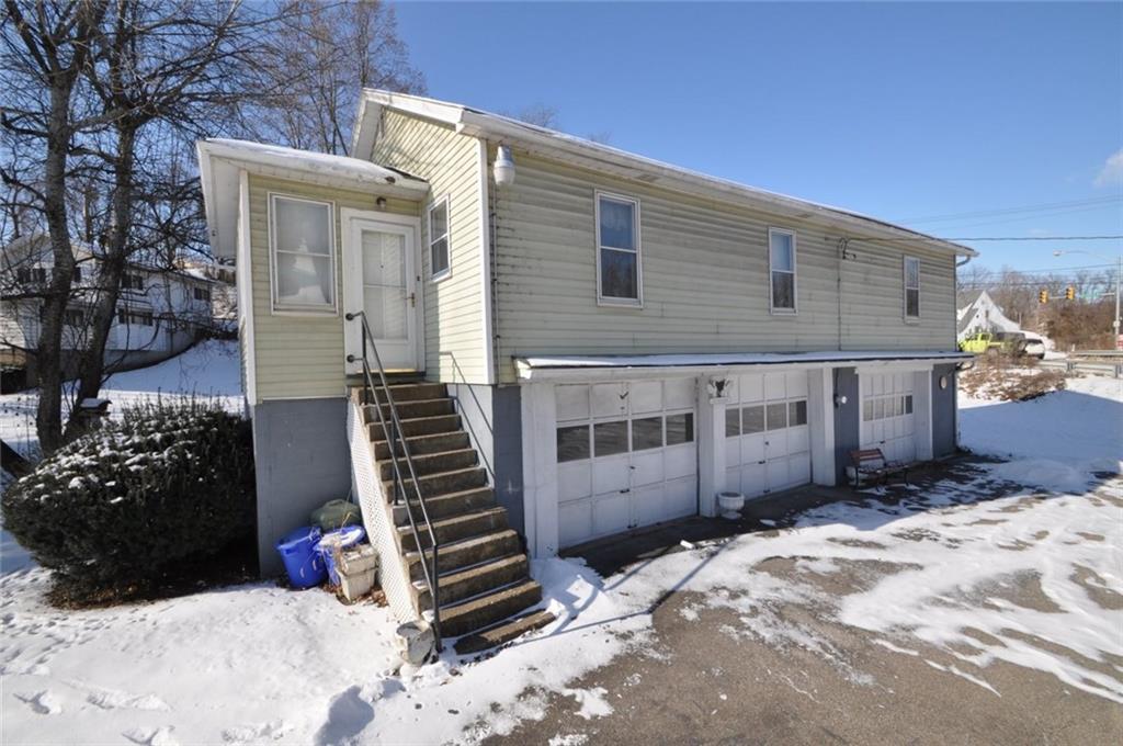 24 Oak Spring Road Washington, PA 15301 - Photo 19 of 25 Garage has two car bays that have steps to the apartment. The 3rd bay is separate and can easily go with the main house.
