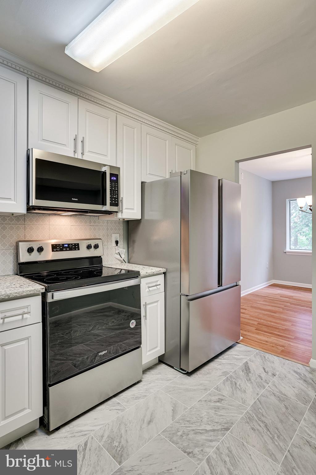 2210 Springwood Drive, Unit 207 Reston, VA 20191 - Photo 15 of 28 Kitchen with tile flooring