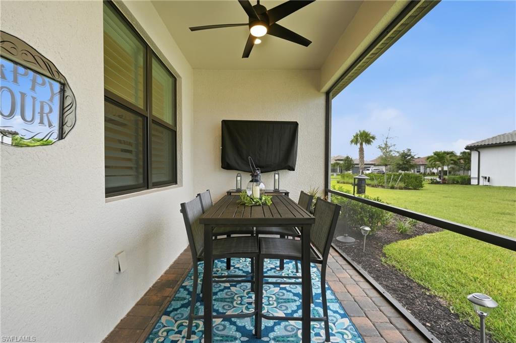 18364 Ridgeline Drive Estero, FL 33928 - Photo 35 of 50 a view of a porch with furniture and a yard