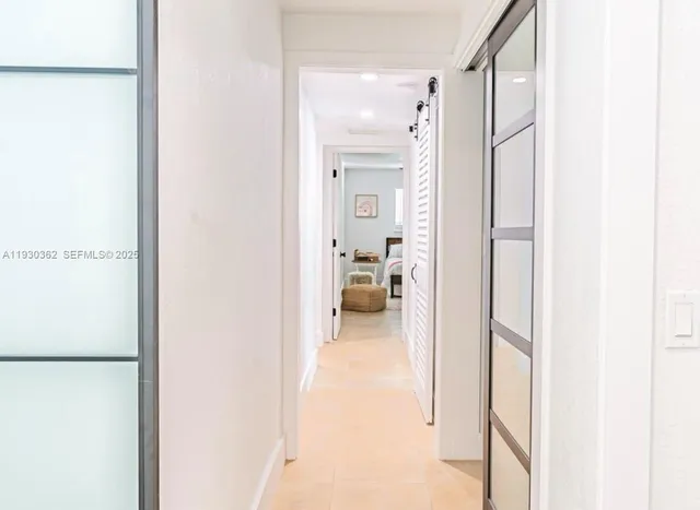 a bathroom with a shower curtain and a sink