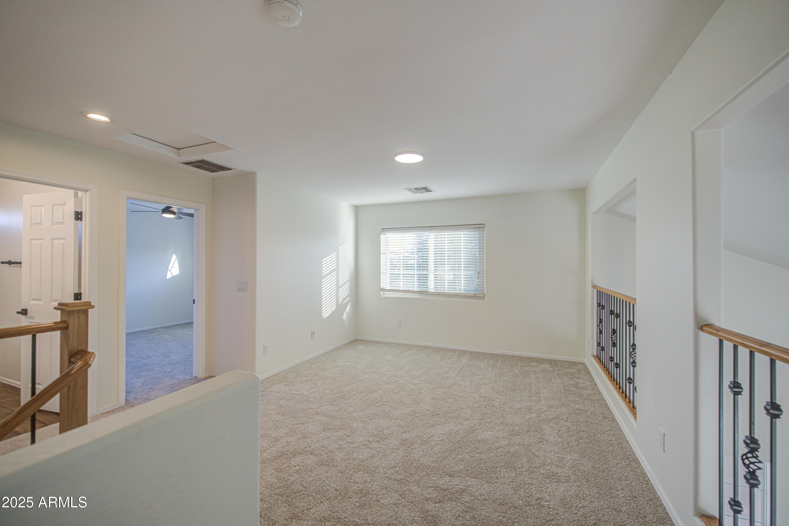 22022 West Moonlight Path Buckeye, AZ 85326 - Photo 19 of 49 a view of an empty room with a window