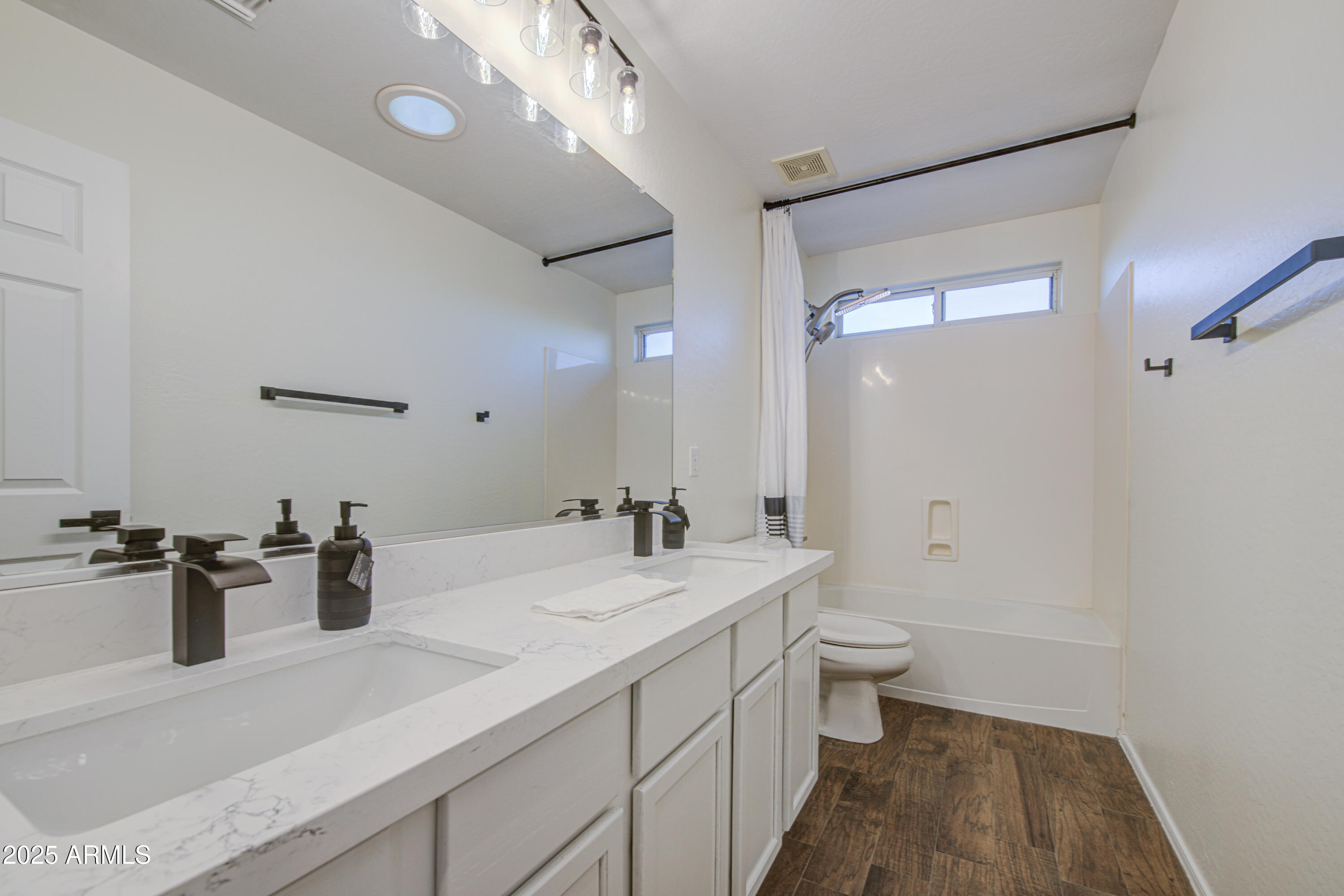 22022 West Moonlight Path Buckeye, AZ 85326 - Photo 23 of 49 a bathroom with a sink a toilet and shower
