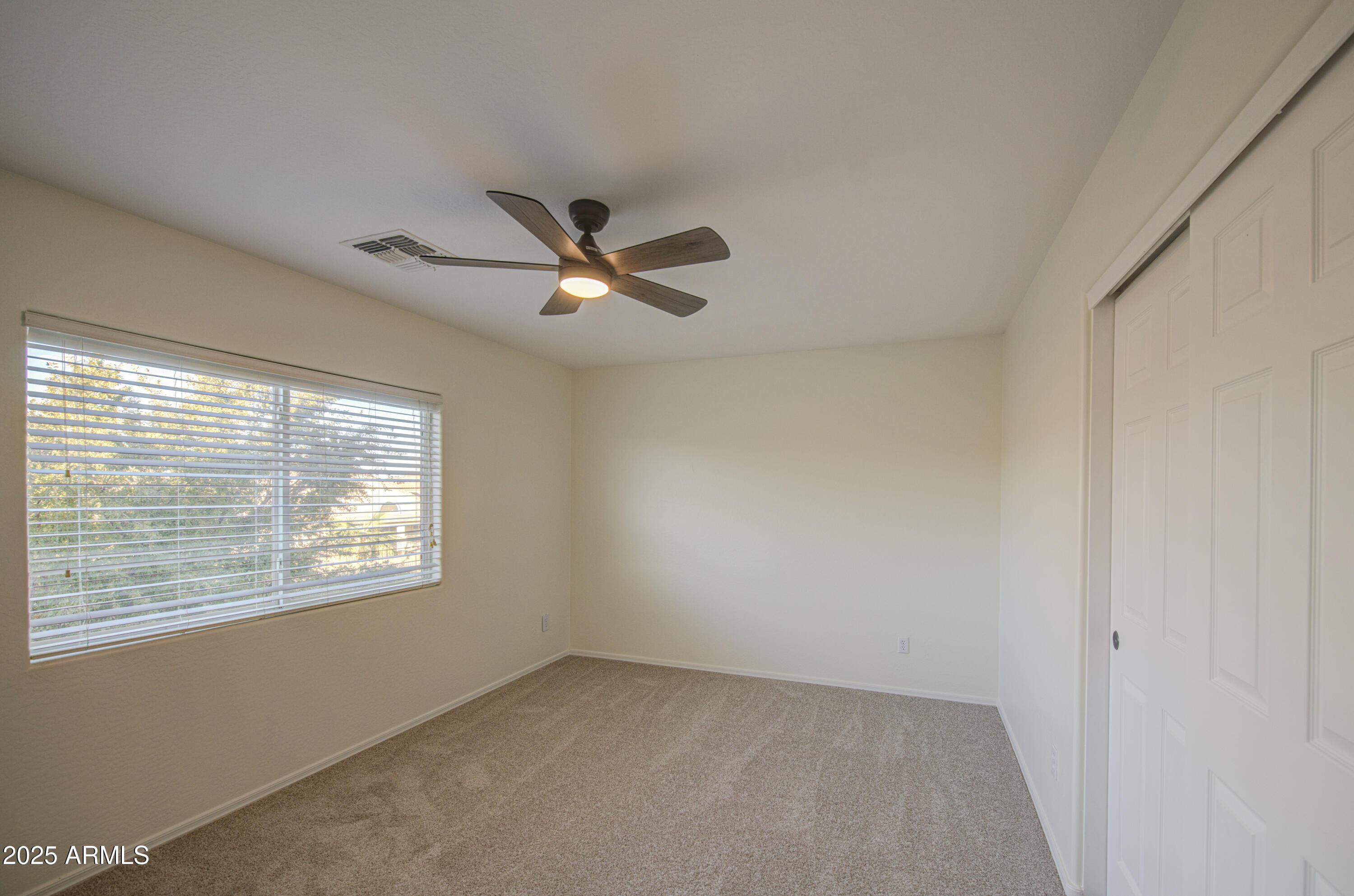 22022 West Moonlight Path Buckeye, AZ 85326 - Photo 25 of 49 a view of an empty room with a window