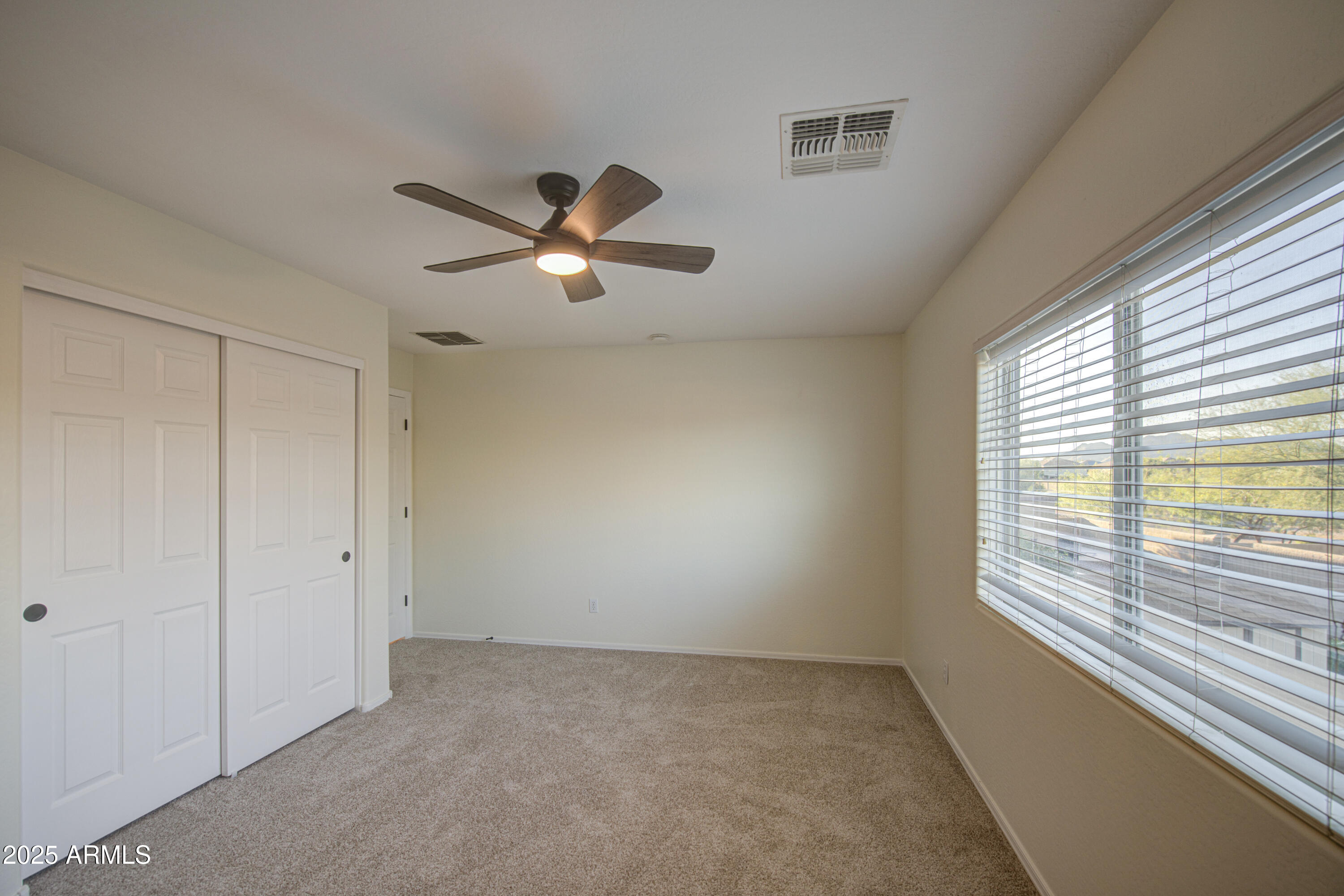 22022 West Moonlight Path Buckeye, AZ 85326 - Photo 26 of 49 a view of an empty room with a window