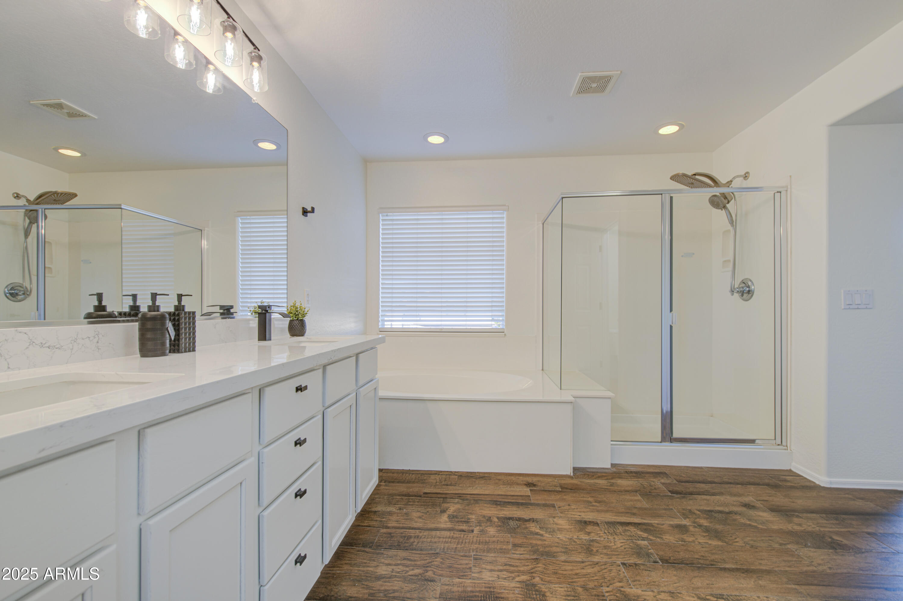 22022 West Moonlight Path Buckeye, AZ 85326 - Photo 32 of 49 a bathroom with a shower sink and mirror