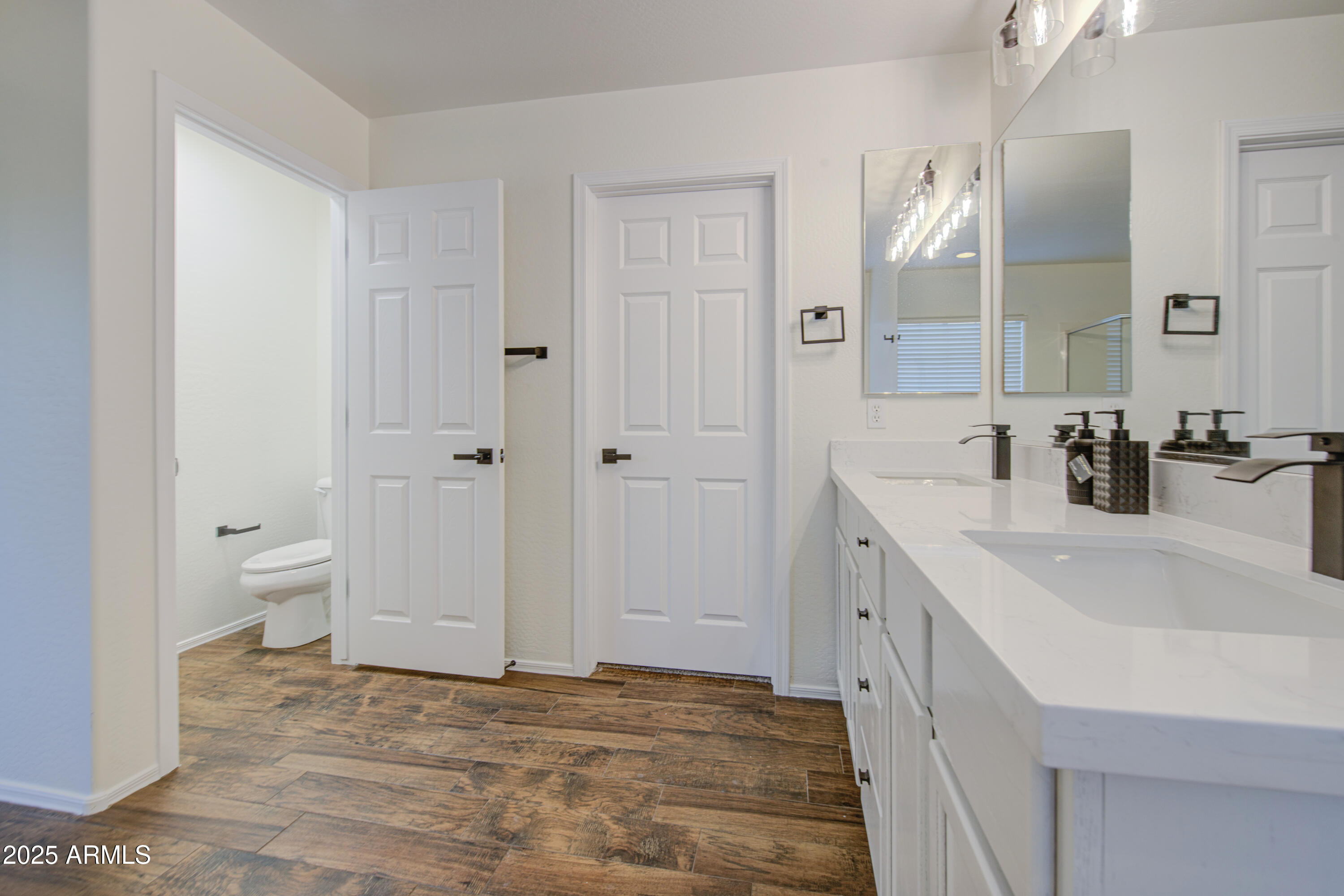 22022 West Moonlight Path Buckeye, AZ 85326 - Photo 34 of 49 a bathroom with a sink and a mirror