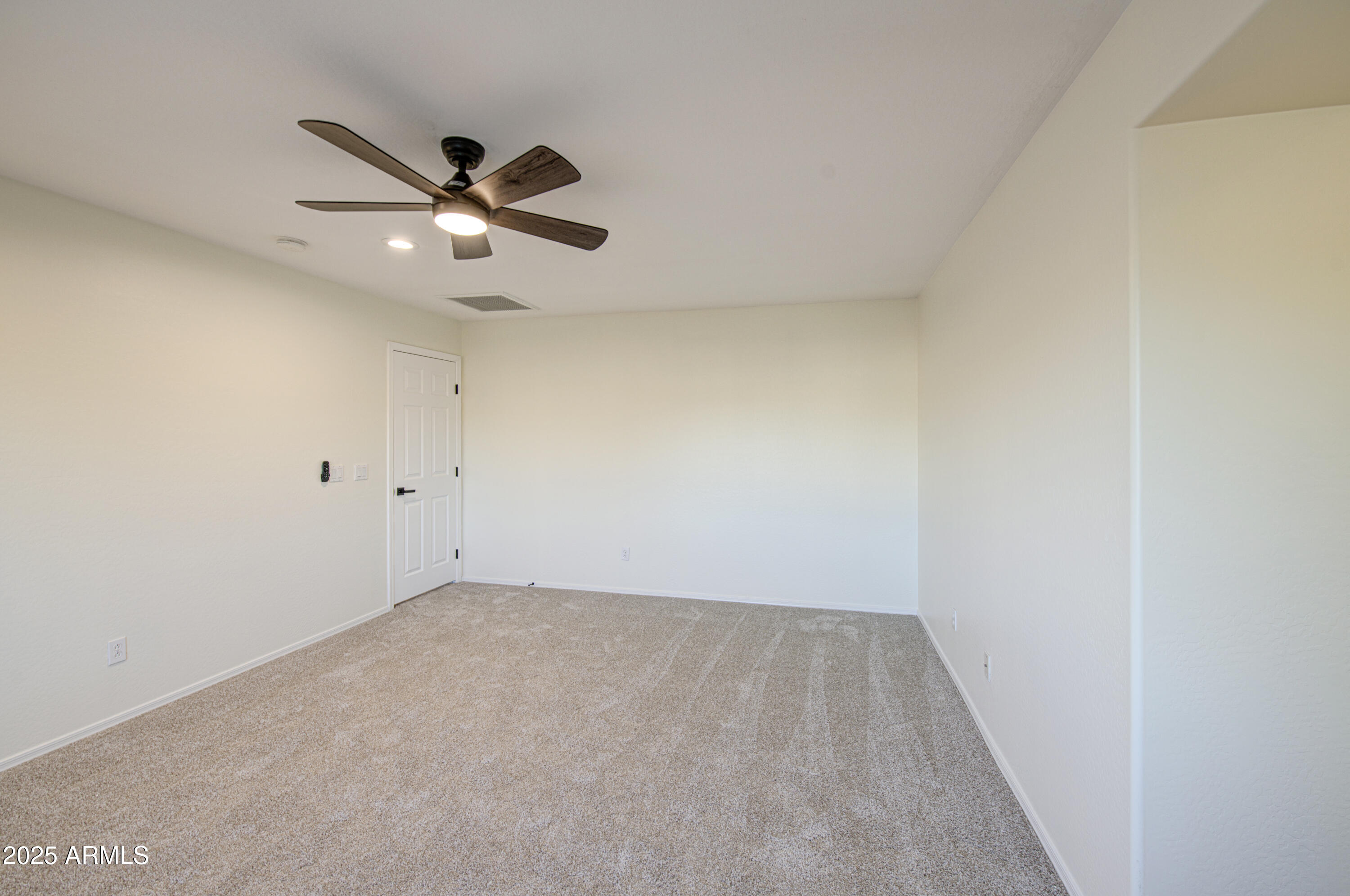 22022 West Moonlight Path Buckeye, AZ 85326 - Photo 36 of 49 a view of an empty room