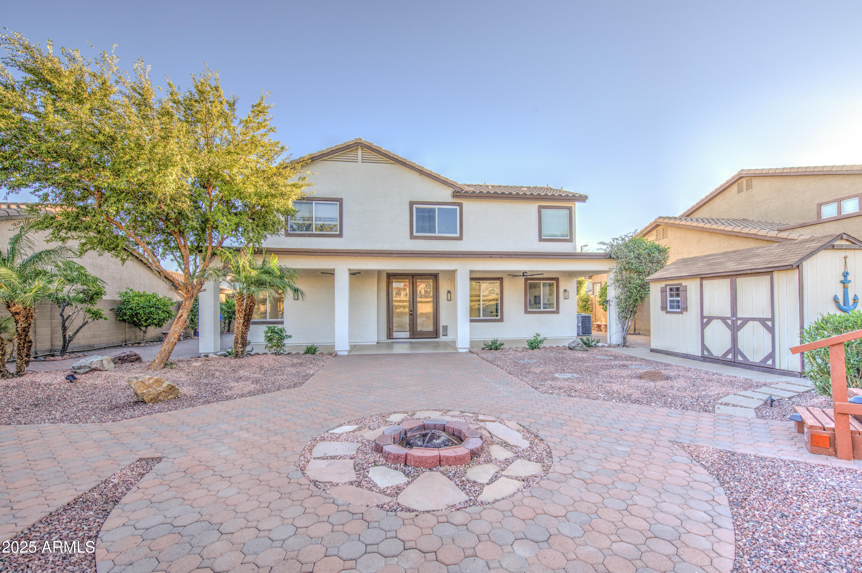22022 West Moonlight Path Buckeye, AZ 85326 - Photo 43 of 49 a front view of a house with a yard