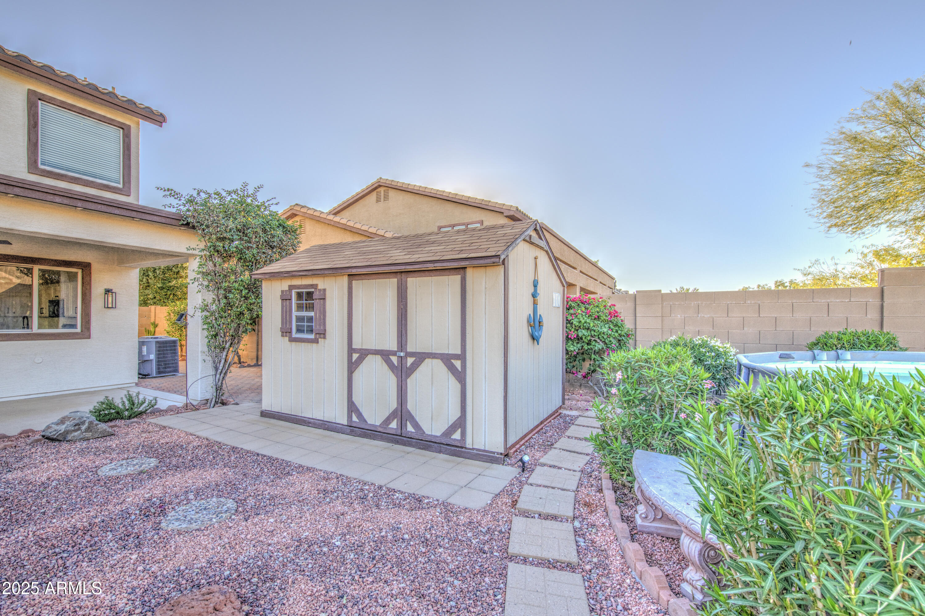 22022 West Moonlight Path Buckeye, AZ 85326 - Photo 44 of 49 a front view of a house with garden
