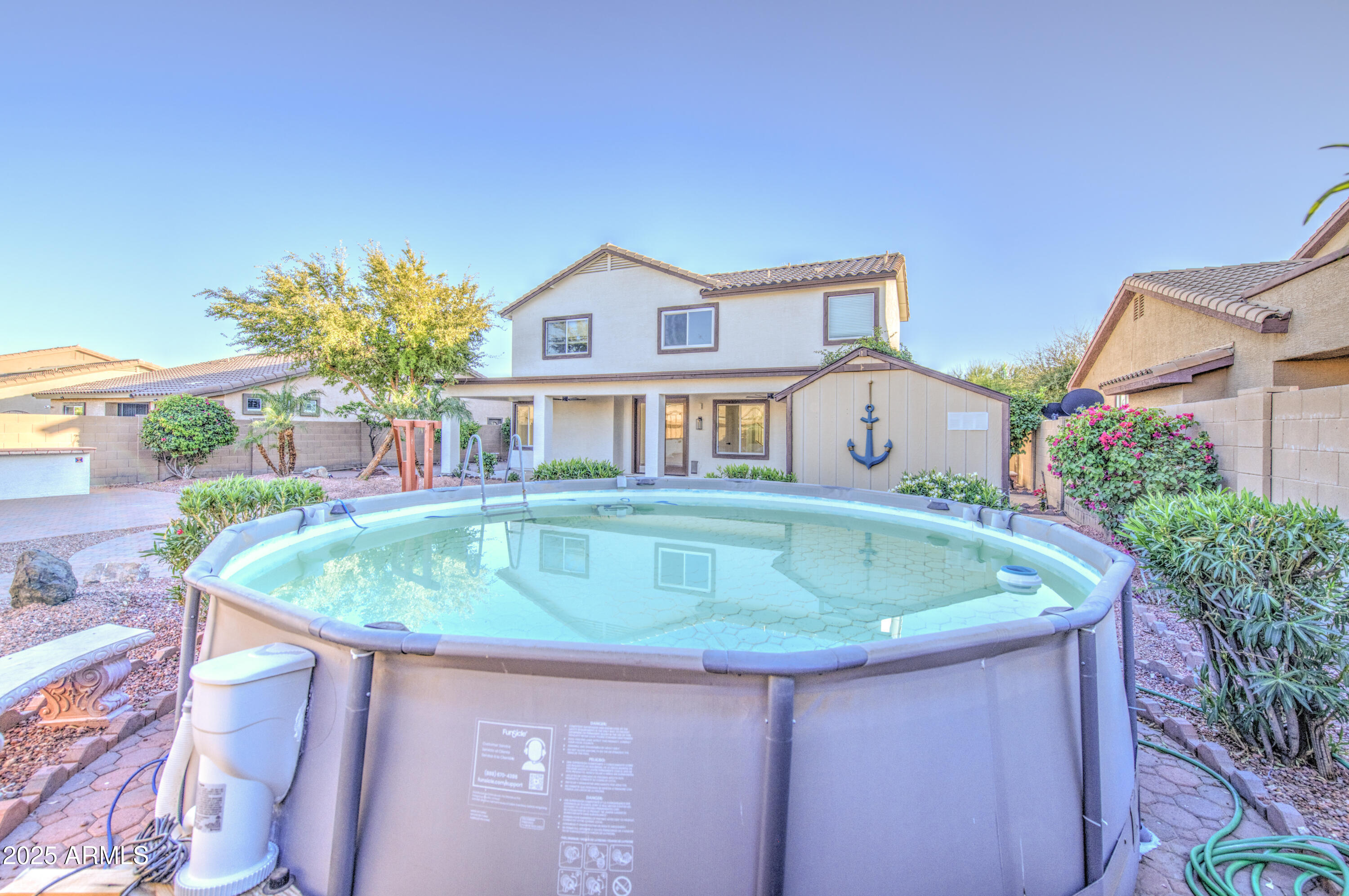 22022 West Moonlight Path Buckeye, AZ 85326 - Photo 46 of 49 a house with swimming pool in front of it