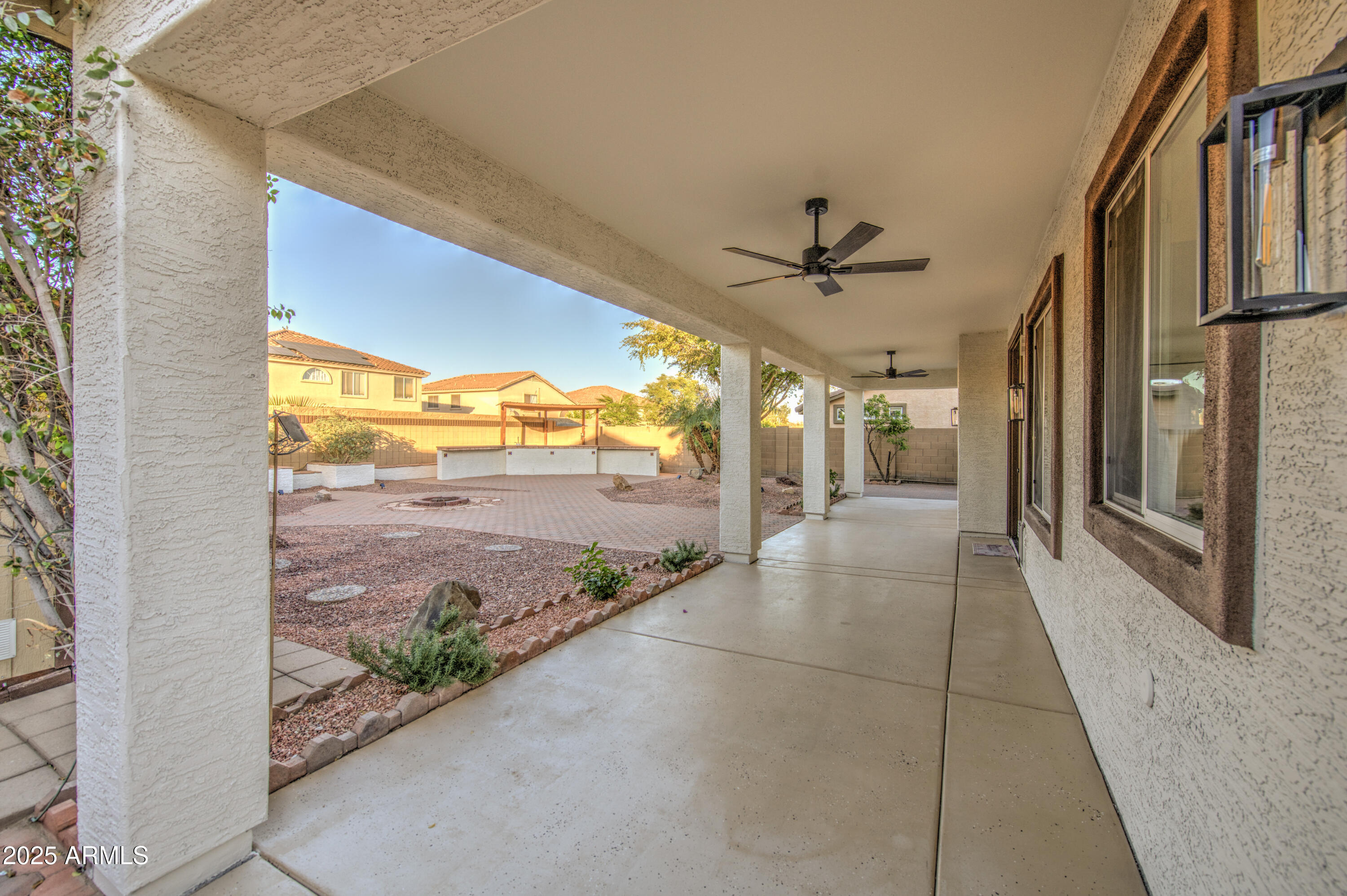 22022 West Moonlight Path Buckeye, AZ 85326 - Photo 47 of 49 a view of interior space with wooden floor and a ceiling fan