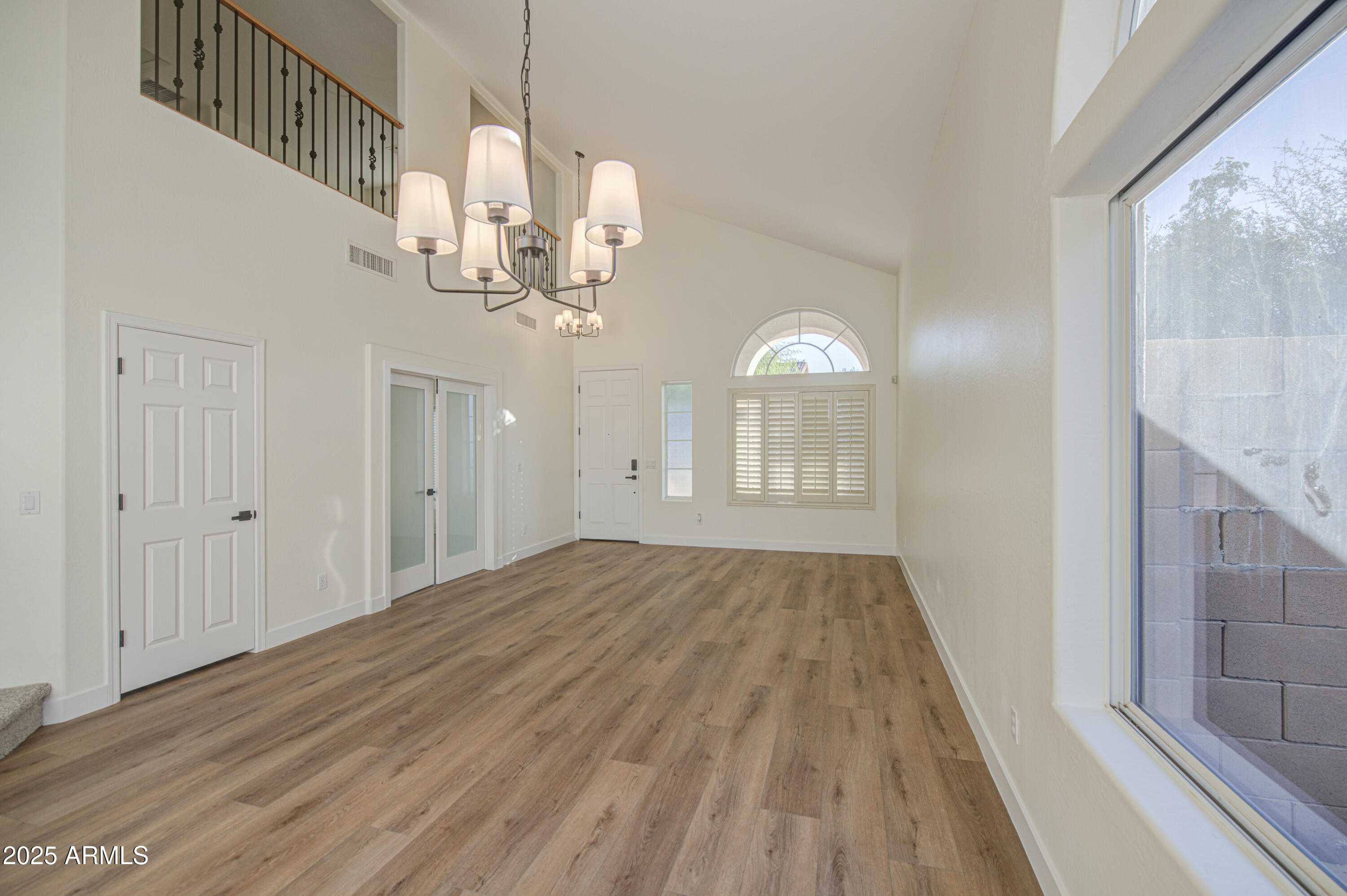22022 West Moonlight Path Buckeye, AZ 85326 - Photo 6 of 49 a view of a livingroom with a staircase